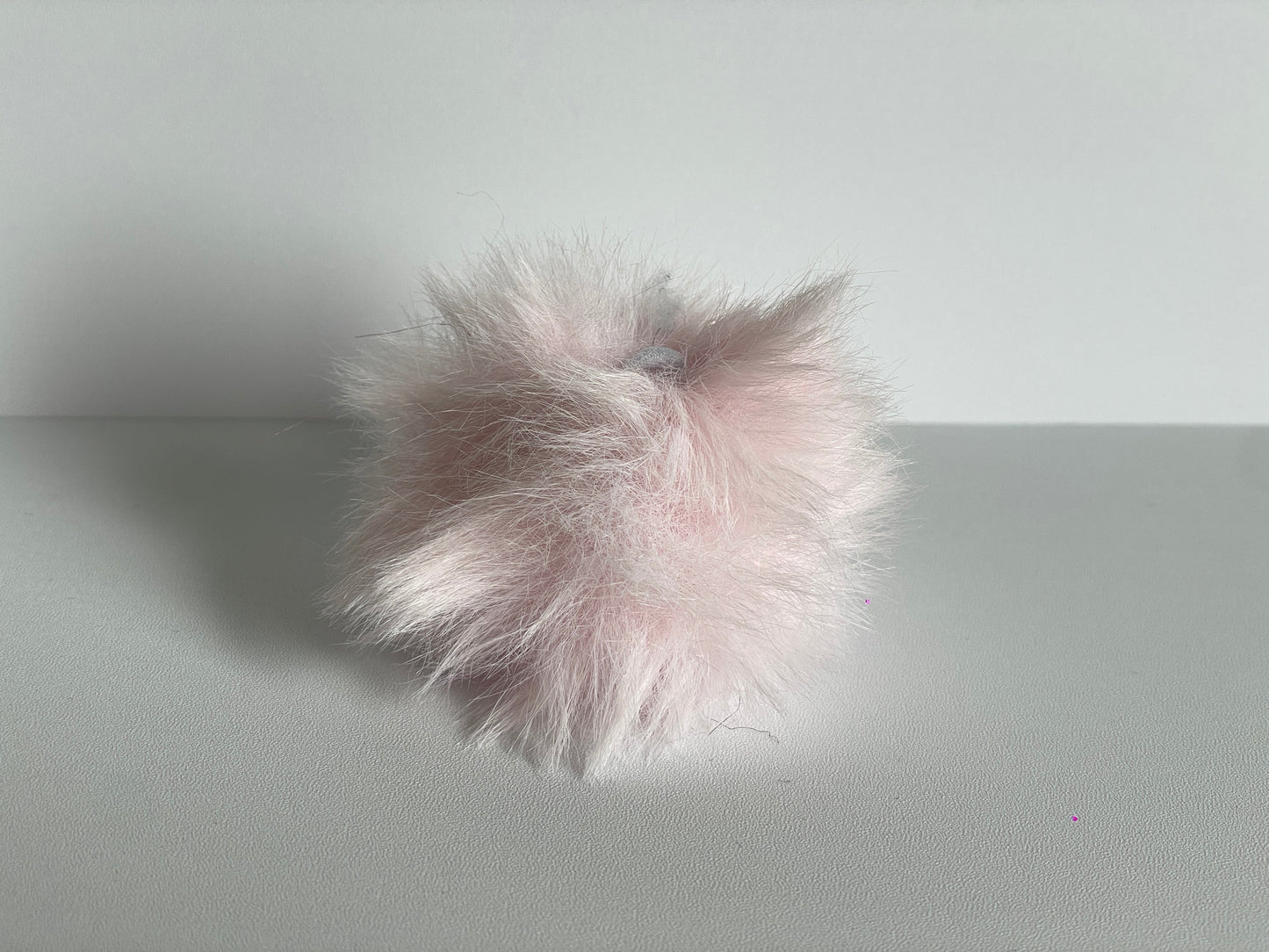 Roze pompom voor aan je sleutelhanger